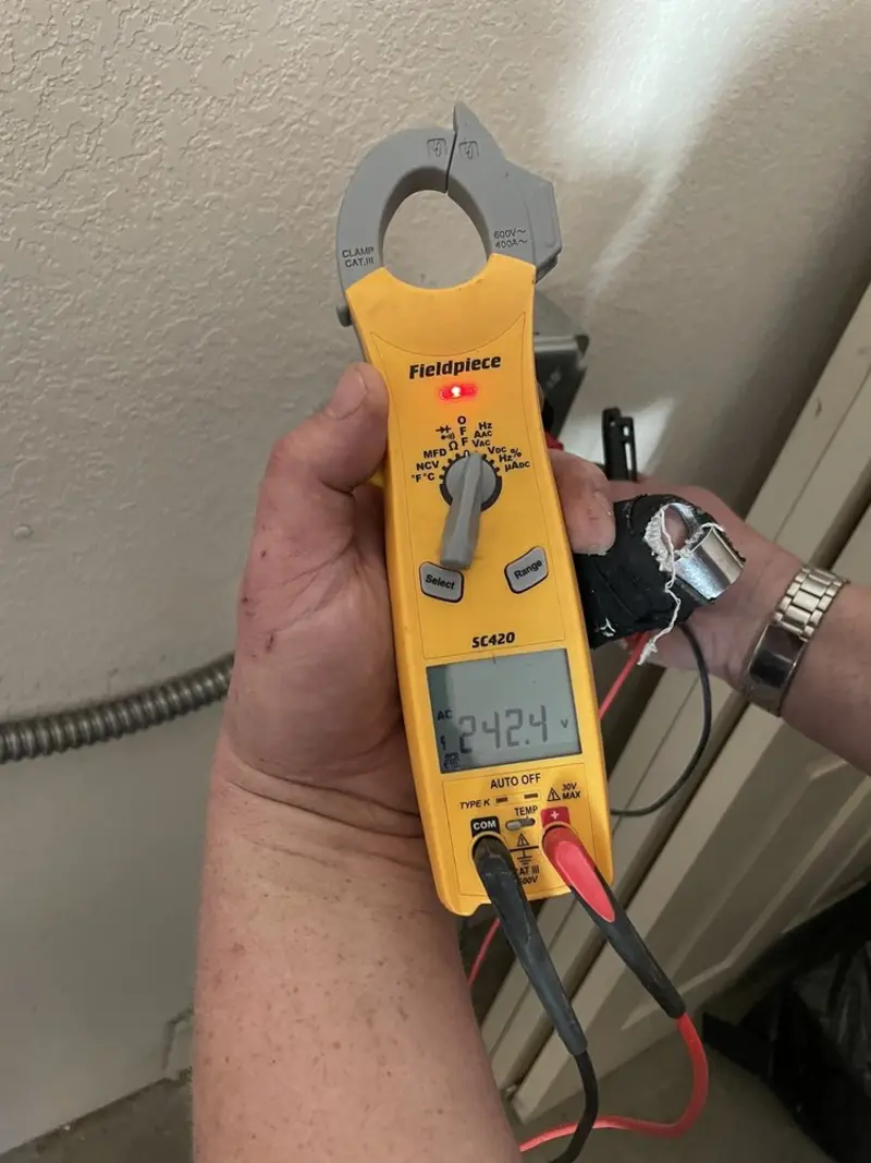Voltage testing with clamp meter during Whole House Surge Protector in North Bethesda